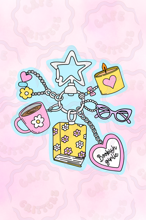 2.5 x 2.5 inch “Bookish Girlie Trinket Keychain” sticker featuring a charm bracelet-style keychain on a soft pink background. The Cafe Critterz design includes a floral-covered book, coffee mug, candle, heart charm, daisy charm, cat-eye glasses, star keyc