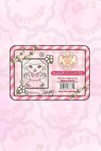 Load image into Gallery viewer, Library card sticker with a pink gingham background and candy-striped border, featuring Sleepy Sweet, a Cafe Critterz character, in a photo-style box on the left. The design includes “Public Library Card,” “This Card Belongs to: Sleepy Sweet,” a Cafe Critterz logo, barcode details, white flowers, leafy vines, and a handwritten-style “Sleepy” signature for a sweet bookish stationery look.
