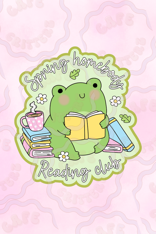 Sticker with a green frog reading a yellow book, surrounded by stacked books, a pink polka dot mug, white daisies, and leafy accents. The text reads “Spring Homebody Reading Club,” giving the design a cozy Cafe Critterz book club feel for springtime readers.