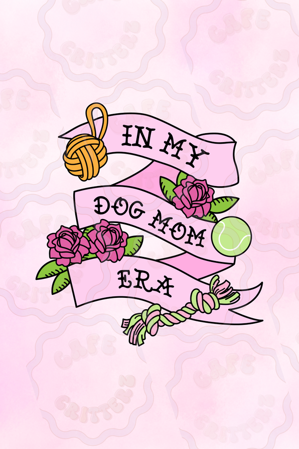 3 x 3 inch “In My Dog Mom Era” sticker with a pink ribbon banner wrapped around dog mom essentials, including a yellow yarn ball, pink roses, green leaves, a tennis ball, and a green and pink rope toy. The tattoo-inspired Cafe Critterz design has soft pink details and playful pet mom charm for dog lovers.