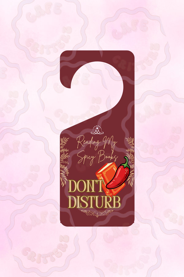 3.5 x 8.5 inch “Busy Reading Spicy Books” door hang tag with a cutout hole at the top and a dark red background. The Cafe Critterz design features the words “Busy Reading My Spicy Books” and “Don’t Disturb,” with small book and red chili pepper details for a cozy romance reader door sign look