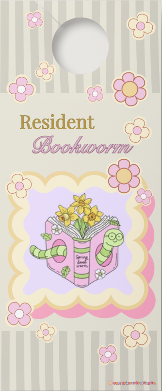 3.5 x 8.5 inch “Resident Bookworm” door hang tag with a cutout hole at the top, gray striped background, and pink flower accents. The Cafe Critterz design features the words “Resident Bookworm” above an open pink book with yellow flowers and a green bookworm character for a cozy book lover door sign look.