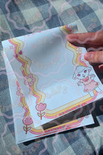 Load image into Gallery viewer, Cafe Critterz style 5" x 7" Sleepy Sweet memo pad featuring a cute cartoon lamb character illustrated in a whimsical lolita inspired design. This retro floral notepad includes decorative rainbow borders and spring picnic blanket details for a playful, cozy aesthetic. Perfect for writing to do lists, reminders, journaling notes, and daily planning, this memo notepad also makes a charming addition to junk journals, scrapbooks, planners, and other creative craft projects.
