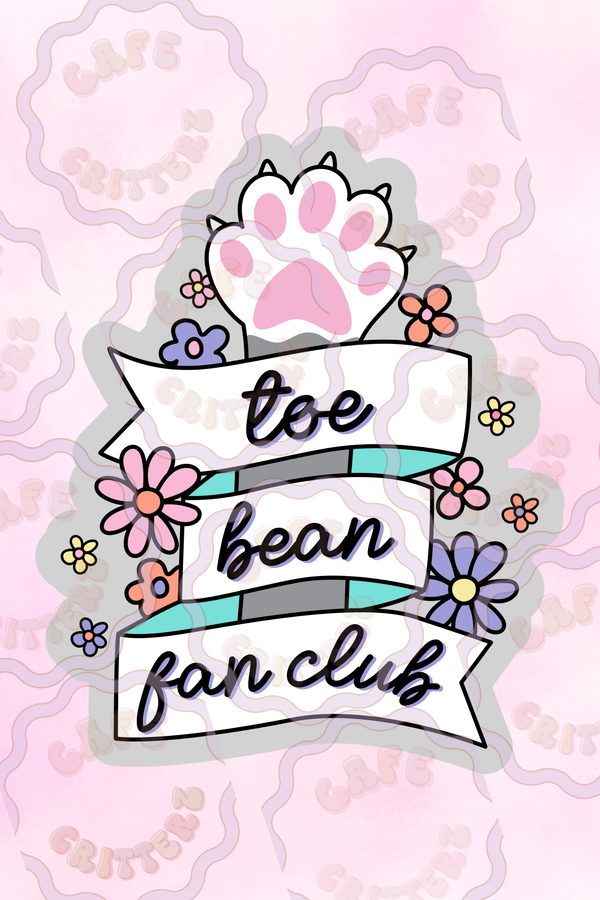 3 x 3 inch “Toe Bean Fan Club” sticker with a pink and white cat paw above ribbon banners that read “toe bean fan club.” The Cafe Critterz design includes pastel flowers, teal ribbon stripes, and soft pink background details for a cute cat lover sticker with cozy pet parent charm.